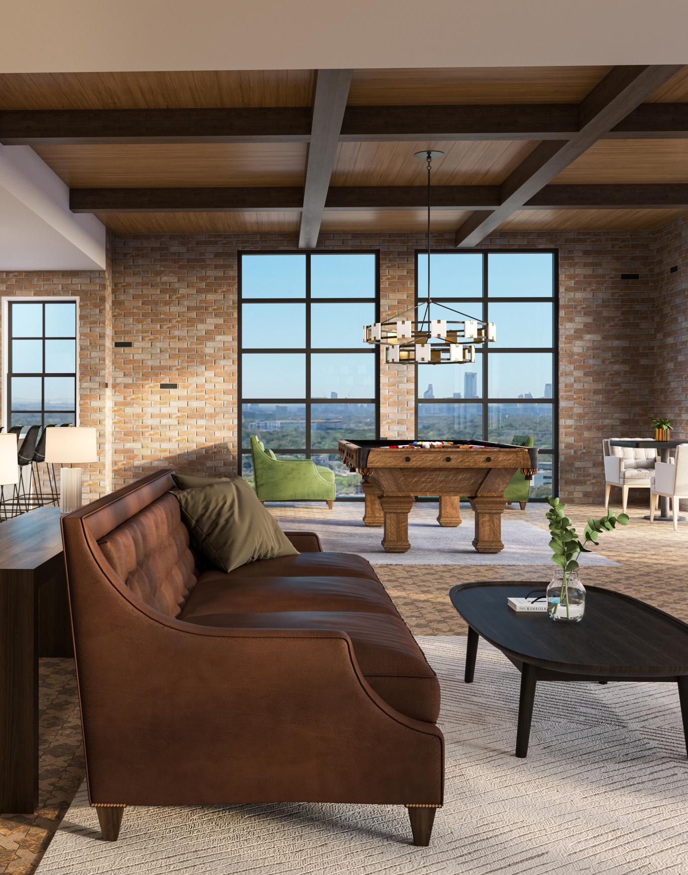 a clubroom with a couch, tables and chairs